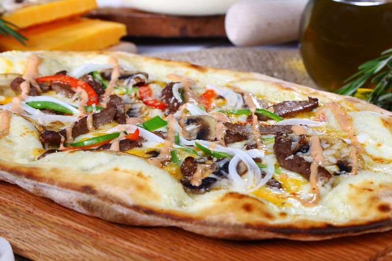 Steak and Cheese specialty sub with mushrooms